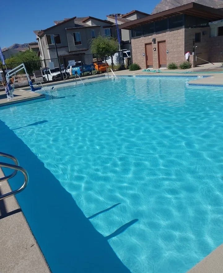 Wide view of clear water in an outdoor pool.