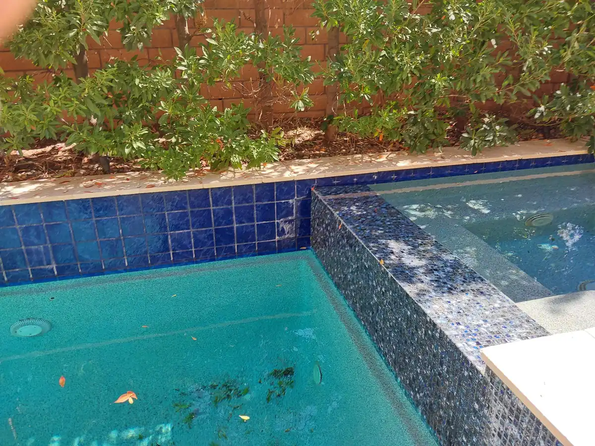 Pool or spa tile and waterline condition before tile bead blast.