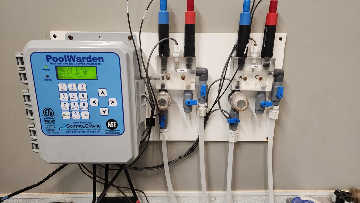 Chemical controller and probe assemblies on pool pipework.