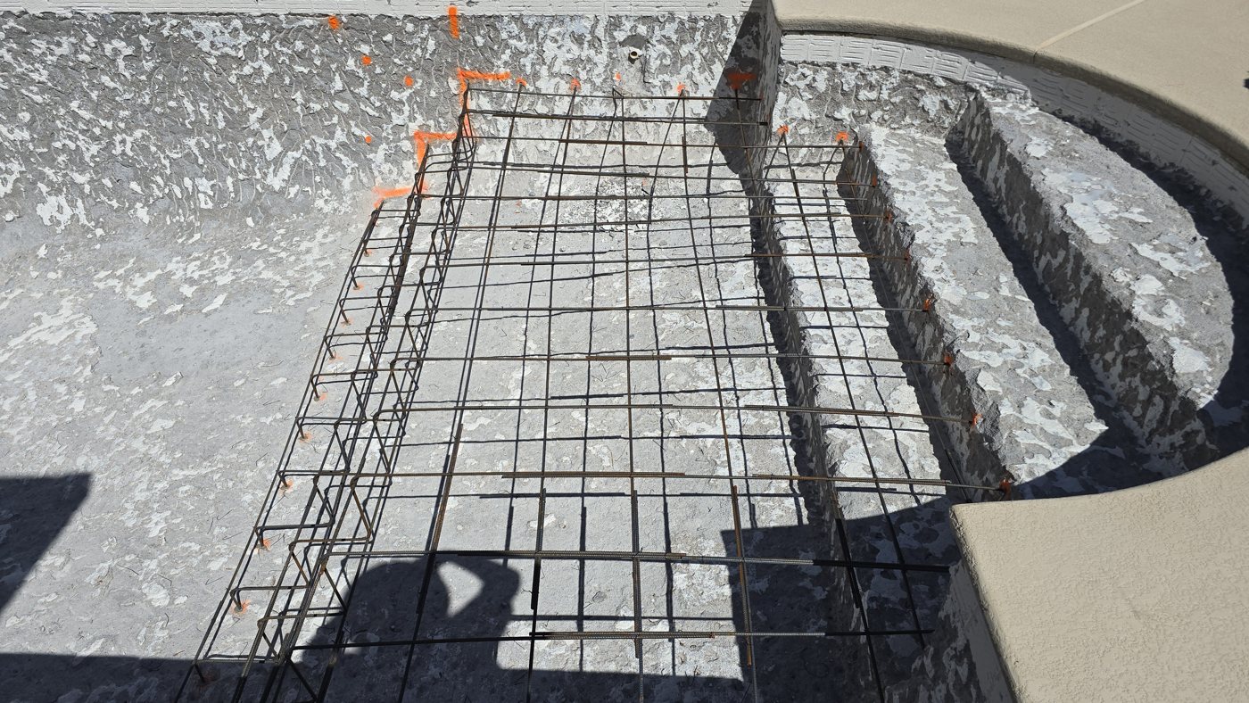 Steel frame for new pool steps during a remodel