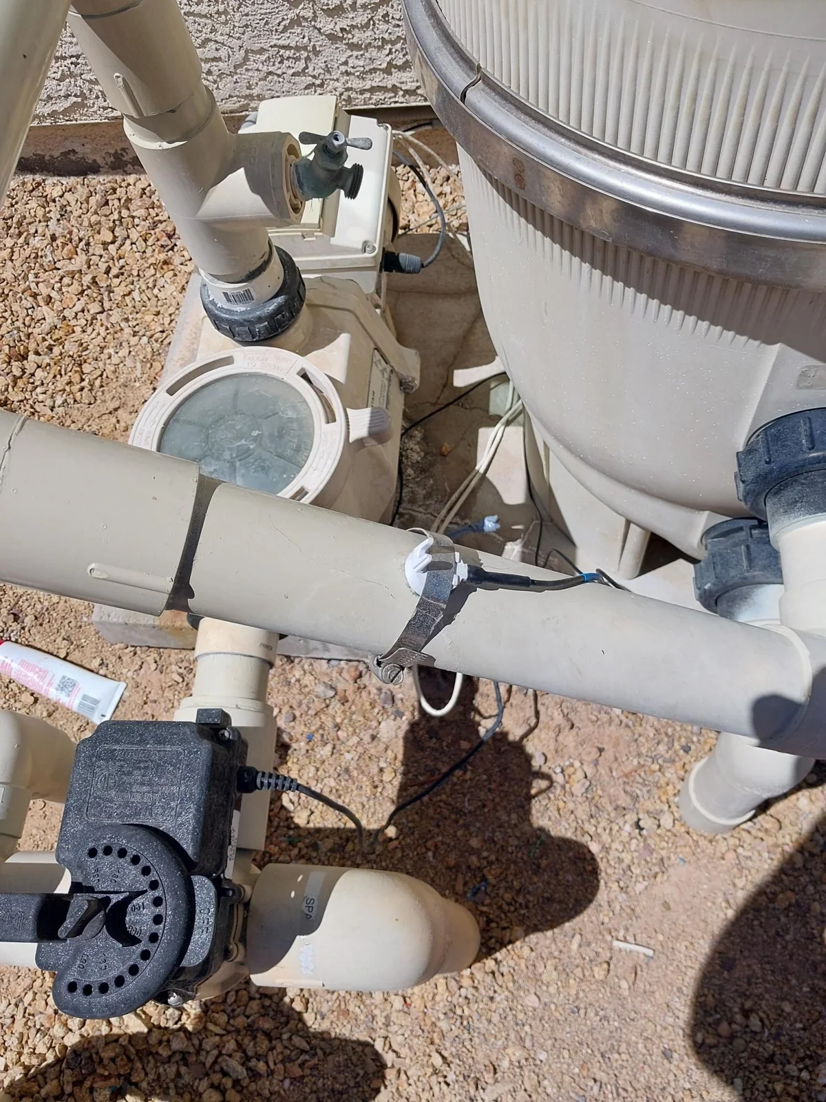 Residential pool pump, filter and PVC pipe connections.