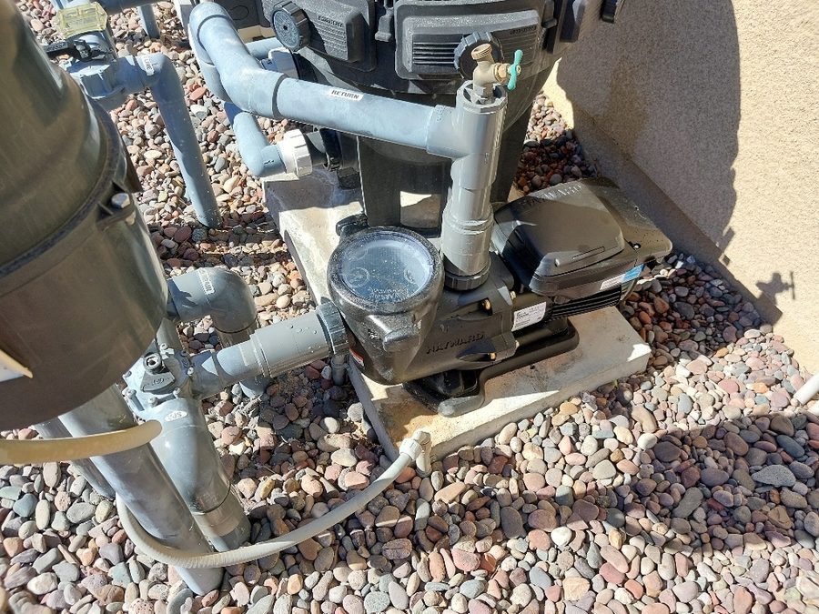Pool pump and cartridge filter on an equipment pad