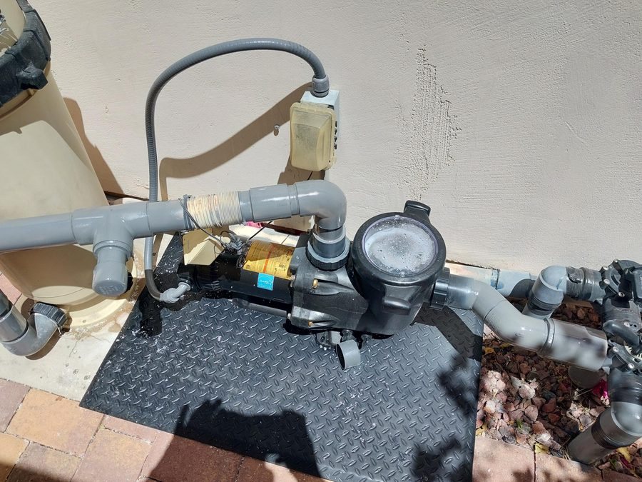 Variable-speed pool pump connected to the pool plumbing