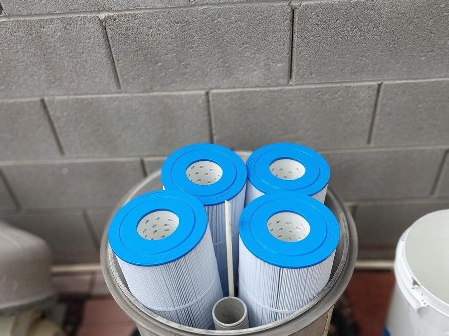 Pool filter opened with its cartridges showing