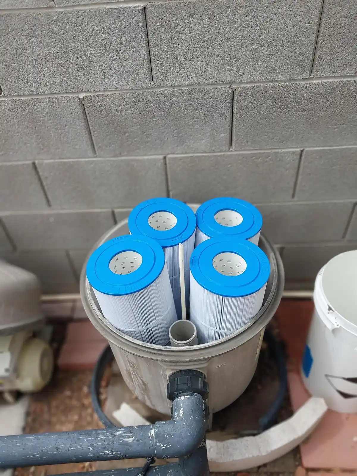 Replacement cylindrical filter cartridges arranged together.