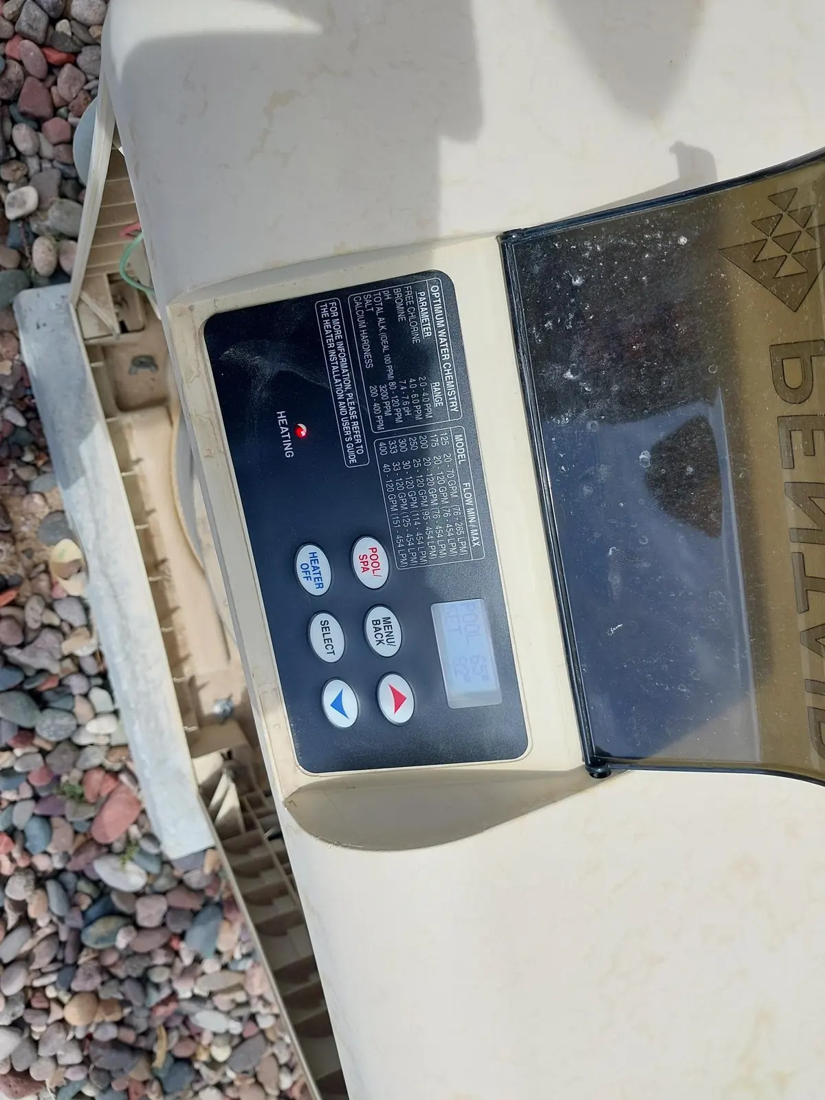 Pool heater keypad and display in an angled close view.