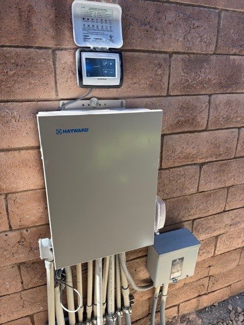 Automation panel beside pool equipment