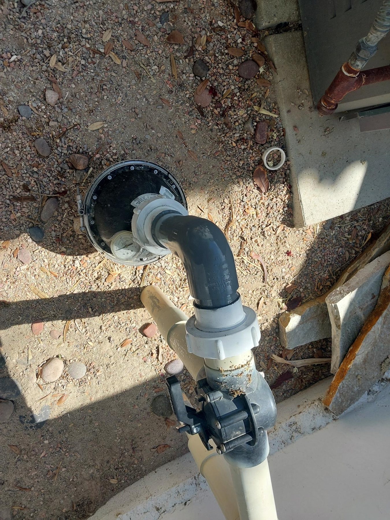 In-floor valve and plumbing exposed for repair