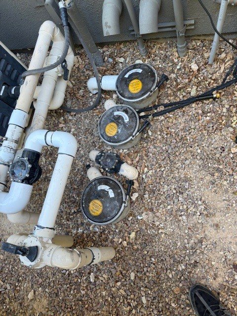 Multiple in-floor water valves at an equipment area