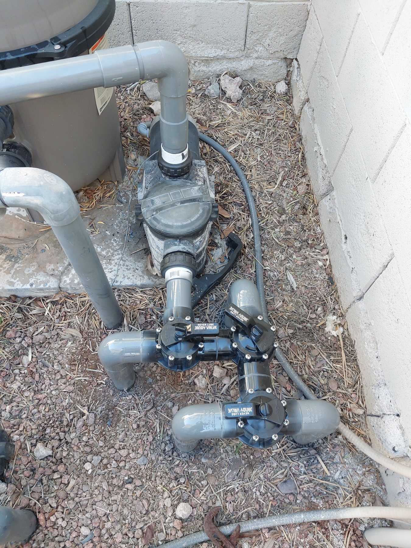 Repaired plumbing at a residential equipment pad