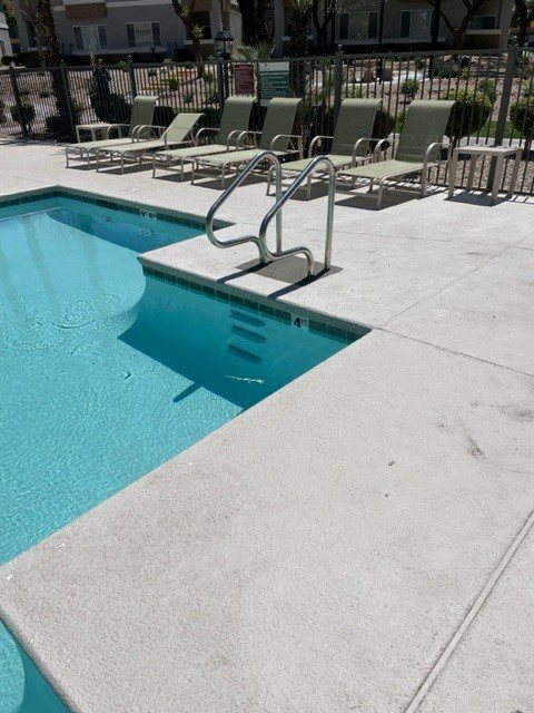 Handrail installed at commercial pool steps
