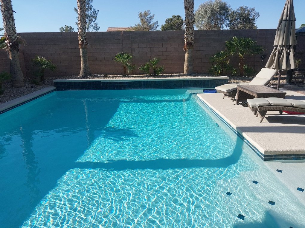 Pool with new blue waterline tile and clear water