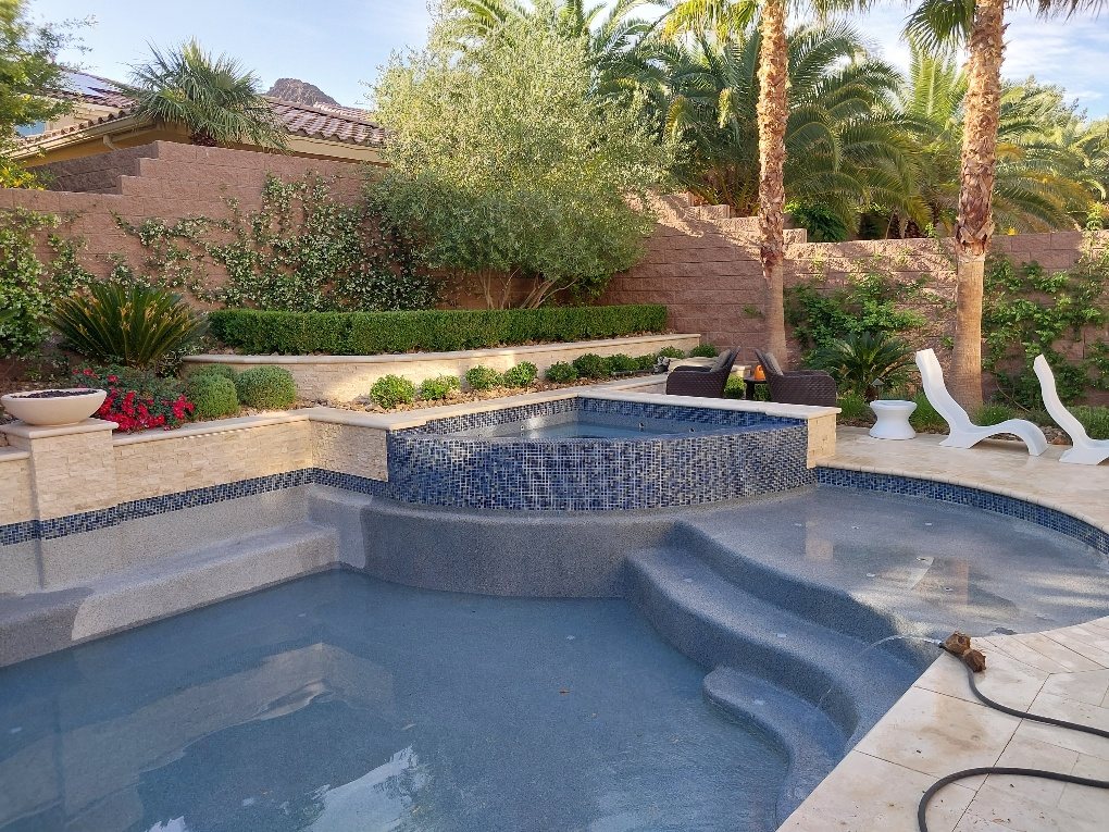 Pool and spa with new tile, partly filled