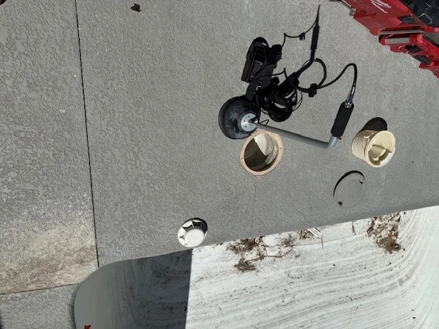 Listening equipment positioned at a pool skimmer for leak detection.