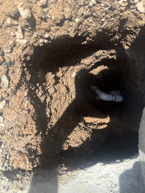Poolside leak investigation equipment or exposed plumbing during repair.