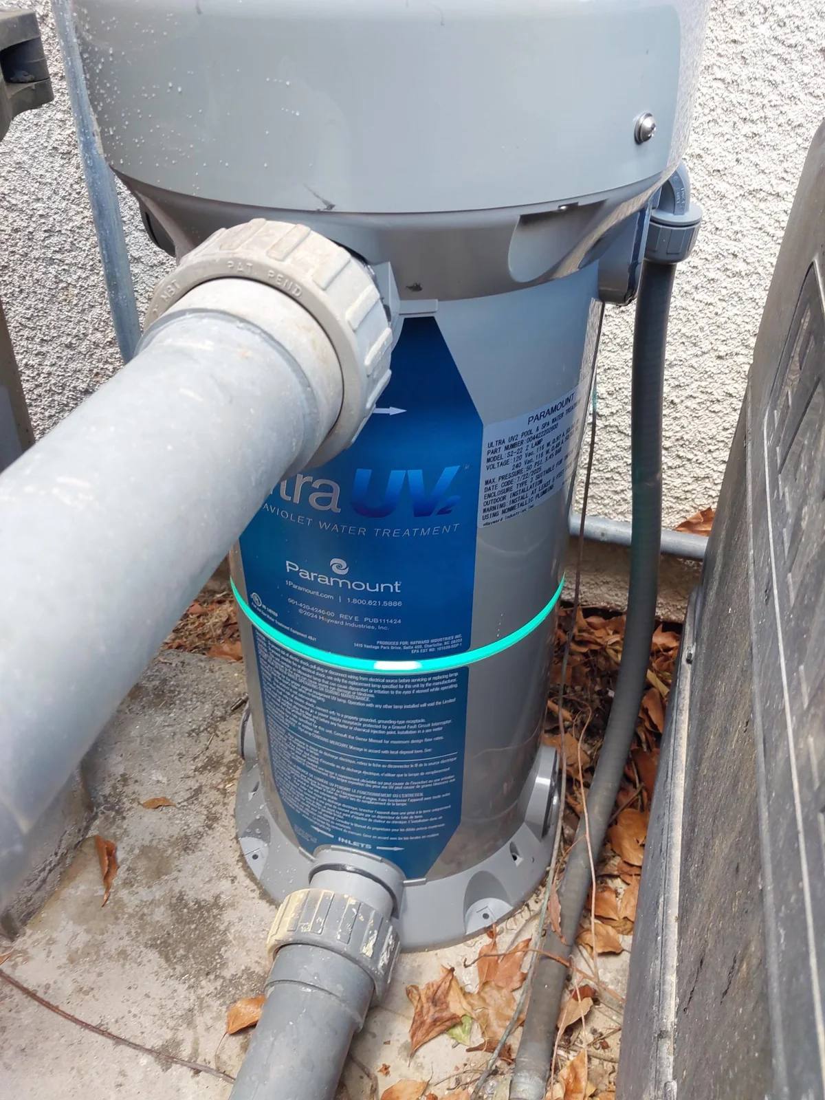 Close view of the UV treatment housing and pipe union.