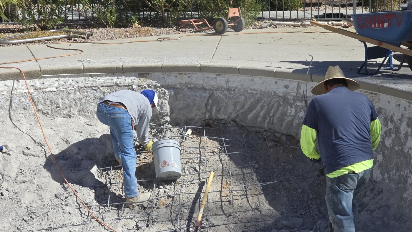 Crew preparing a commercial pool for resurfacing