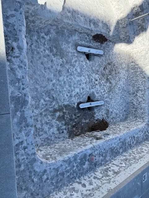 New suction outlet plumbing in a drained pool