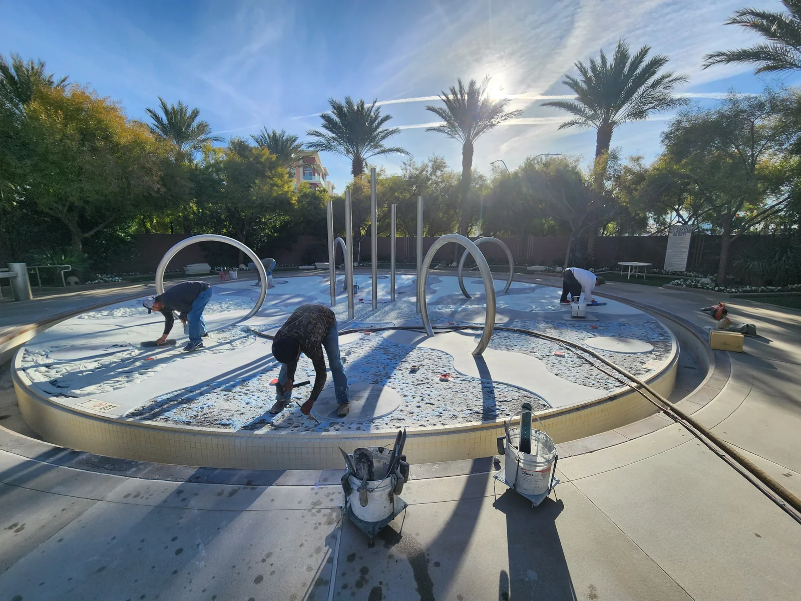 Drained splash-pad surface during plaster preparation.