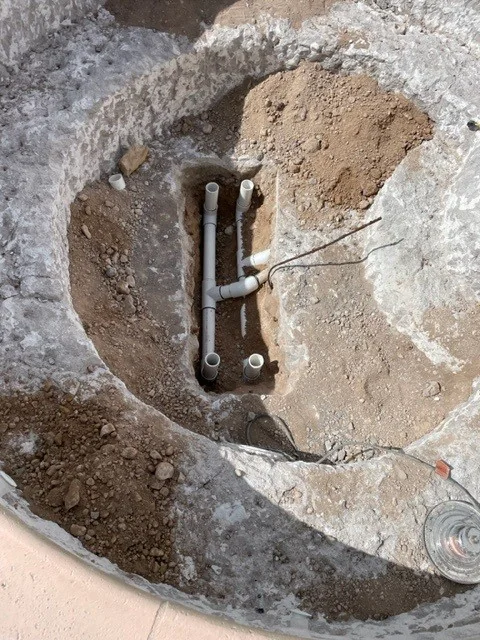 Drain sump during installation in a drained pool.