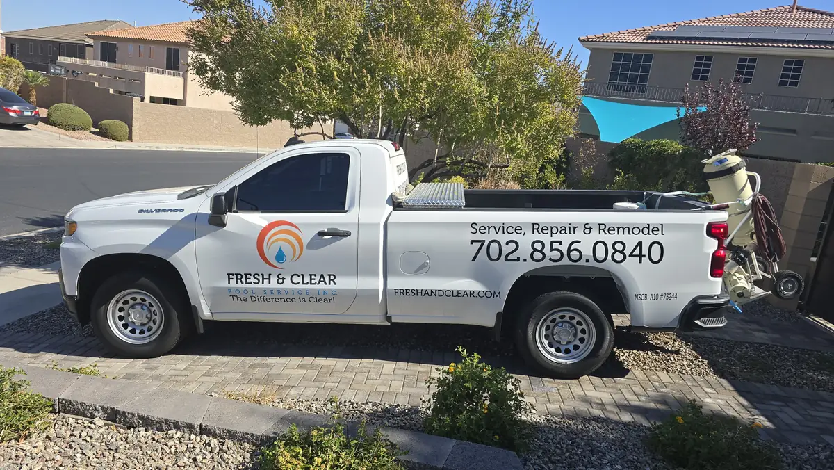 White Fresh & Clear service pickup carrying pool-service equipment.