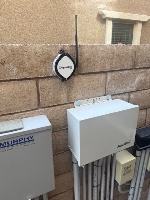 Pool automation control panel mounted on an equipment wall.